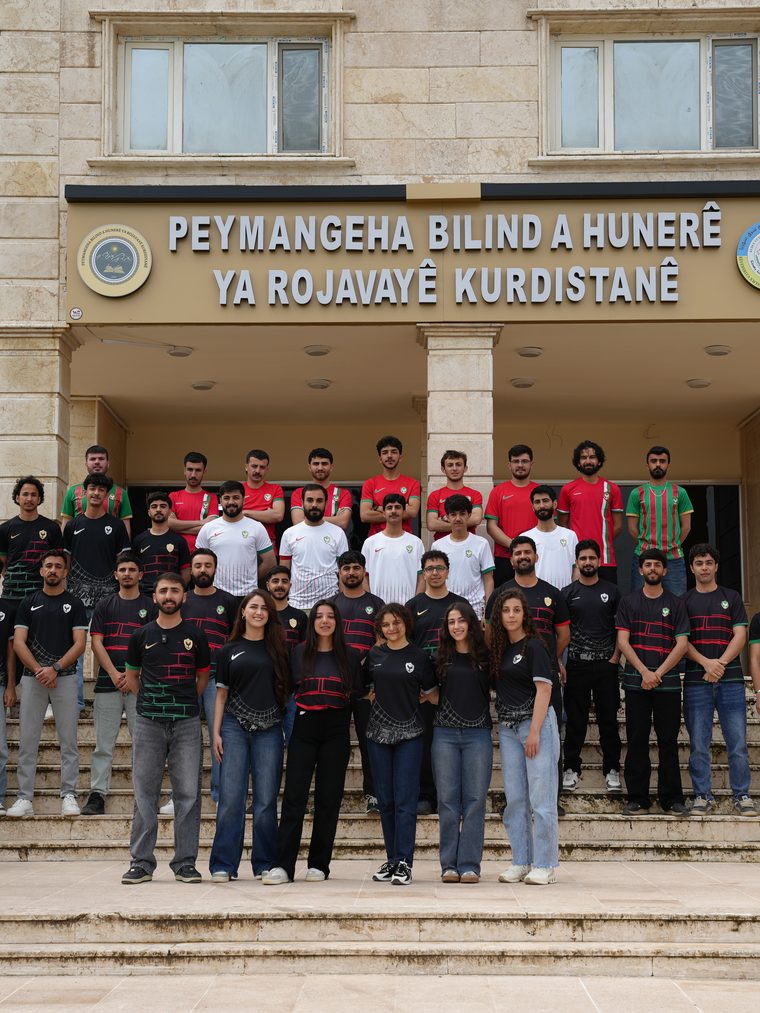 Students of Culture & Arts College in front of the college building